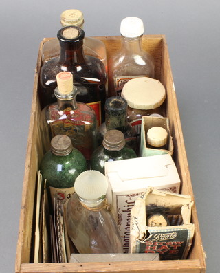 A Brown & Polson's patented corn flour box containing  a Vitalizer drink, a bottle of Mexican brand insect fluid and various other bottles