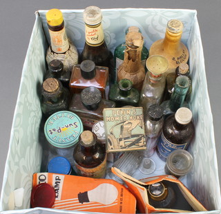 A bottle of Chefs tomato ketchup, a bottle of Lea and Perrin's sauce and other various bottles, 2 Cryselco light bulbs