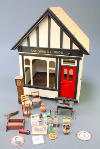A model Antique and Curios dolls house shop with furniture 18" x 12" x 11" 