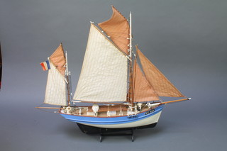 A wooden model of San Juan a fishing boat 20" x 23" x 5", do. Marie-Jeanne 18" x 16" x 5 1/2" and a wooden model long boat 16" x 22" x 5 1/2"  