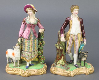 A pair of 19th Century English porcelain figures of a lady and gentleman, the lady with sheep and the gentleman with a dog on raised rococo bases 6" 