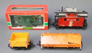 A LGB Lehmann 4065 goods train guards van together with a 3019N parcel/mail van, a 4011 hinged-hutch wagon, a 3510 open truck, all boxed