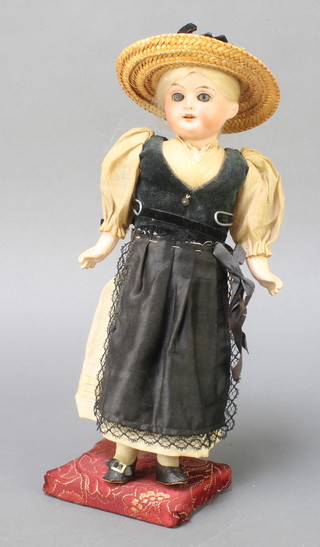 AM Dep Germany, a 19th Century porcelain headed doll with sleep eyes, open mouth and teeth, the head incised 1894 AMD Germany 6/0, with articulated limbs 10" 
