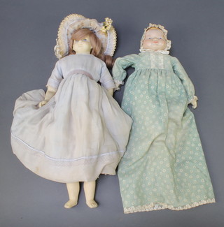 A wax headed and limbed costume doll 17" and a ditto baby doll 12" 