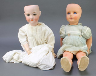 Armand Marseille, a German porcelain headed doll with sleep eyes, open mouth and teeth, head incised AM Germany 390A9M with articulated body 25" and 1 other porcelain headed doll with sleep eyes and squeak