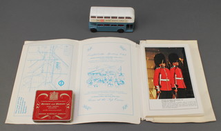 A Corgi model of a British European Airways double decker bus, ditto visitors guide to London and the South East, an empty tin of Benson & Hedges Superior Virginia cigarettes,  a Minibrix Building set no.1 and a Monopoly set (no pieces) 