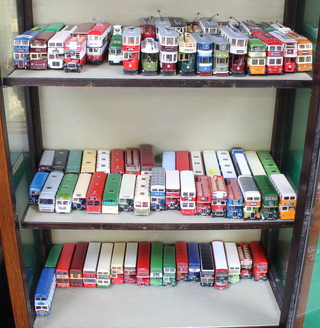 A collection of 17 model trams, 7 model trolley buses together with 59 model omnibuses and motor coaches  boxed together with a collection of various empty model boxes