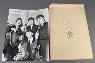 A Reville Special giant size Beatles poster 39 1/2" x 60" contained in original brown envelope postmark 2nd October 1963 together with 3 TASRC still photographs  SP564, SP585, SP588 14 1/2" x 11 1/2" (corners slightly dogeared) 
