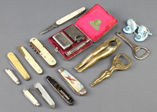 An Ever Ready safety razor, 9 various folding pocket knives, 2 crown cork bottle openers etc 