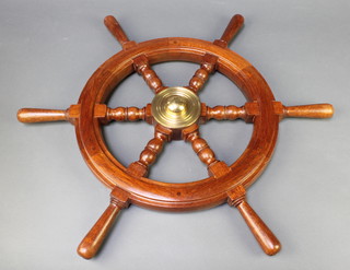 A wooden and brass 6 spoked ships wheel 24" diam.