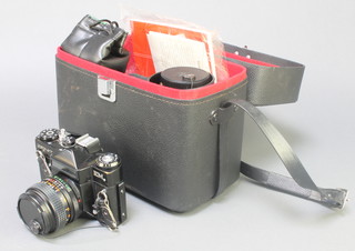 A Zenith  E M camera with Helios 1:2.8 lens, a Helios-44mm 2/58 lens, an Intercity auto lens 1:5.5 F=80-20mm no.C-85401 lens with carrying case 
