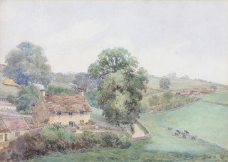 An Edwardian watercolour, monogrammed and dated, a rural scene with cattle before buildings 9 1/2" x 13" 