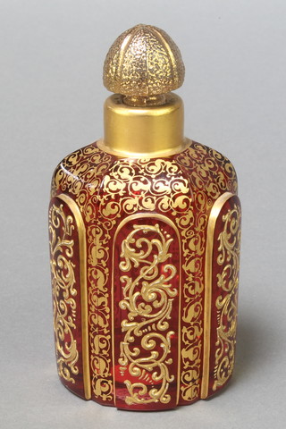 A 19th Century ruby glass gilt decorated Bohemian hexagonal scent bottle decorated with floral scrolls having a later stopper 5" 