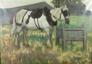 An Edwardian oil on canvas, unsigned, study of a shire horse by a trough with distant farm buildings, 24" x 34" 