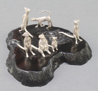 A Patrick Mavros group of six miniature silver Meerkats on a blackwood base 3"  