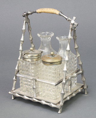 An Edwardian silver plated 4 bottle cruet set, the base with faux bamboo supports 