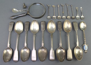 A silver handled magnifying glass and minor silver cutlery, weighable silver 198 grams