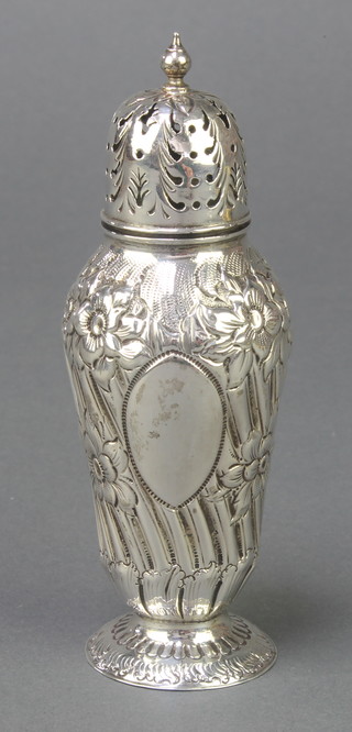 A silver repousse baluster pepper, 52 grams, 4 3/4"