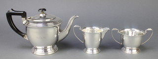 An Art Deco silver 3 piece tea set with ebony mounts, Birmingham 1936, gross 650 grams