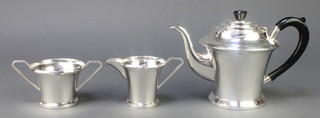A silver Art Deco 3 piece tea set with ebonised mounts, Birmingham 1936 