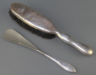 A Victorian silver clothes brush Birmingham 1898 and a silver handled shoe horn 