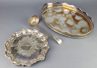 A silver plated oval galleried 2 handled tray 18", a salver and a ladle 