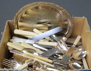 A silver plated sauce boat and salver and minor plated cutlery 