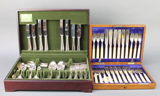 A modern canteen of Arthur Price cutlery for 8 comprising 60 pieces together with an oak canteen containing a set of fish eaters for 12 