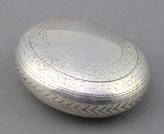 A Victorian oval silver tobacco box with chased decoration Birmingham 1877, 65 grams