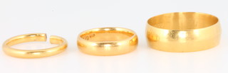 Three 22ct yellow gold wedding bands size J, K and X, 14.5 grams
