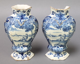 A pair of early 19th Century Delft hexagonal baluster vases decorated with figures in landscapes 7 1/2" 