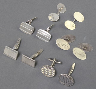 A pair of silver bright cut cufflinks and 4 other pairs