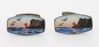 A pair of Danish silver and guilloche enamel cufflinks with sunset coastal scene