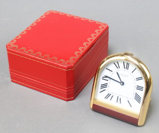 A Cartier gilt cased bedroom timepiece with cabochon set winders 01744, boxed and with original certificate 