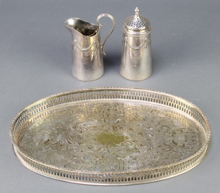 An oval silver plated tray 12 1/2", a plated sugar shaker and cream jug