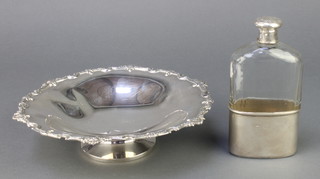 A silver tazza with fancy rim Birmingham 1929 9", 264 grams together with a Victorian cut glass silver mounted hip flask London 1894