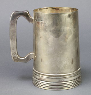 A silver mug with ring turned base, Sheffield 1927, 440 grams, 5 1/2" 