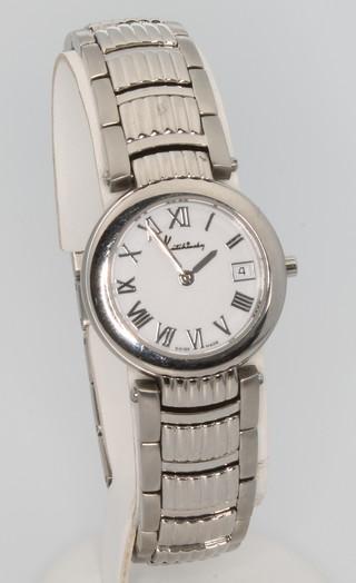 A lady's Kutchinsky stainless steel quartz wristwatch with calendar dial on a ditto bracelet 