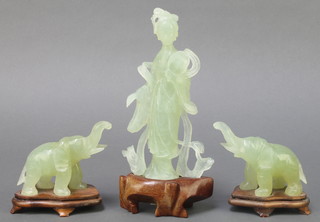 A nephrite figure of a standing lady on a hardwood base 7", a pair of ditto elephants 3" 