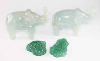 A pair of jadeite carvings of elephants 2 1/2" and 2 modern jadeite pendants 1" 