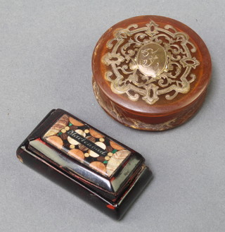 A 19th Century turned amber pill box with cut gilt rococo decoration 1 3/4" and a rectangular tortoiseshell hardstone inlaid pill box 1 1/2" 