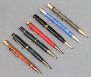 An Art Deco orange marble propelling pencil and 6 others