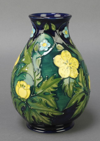 A  Moorcroft baluster vase, the blue ground with spring flowers, impressed marks 7 1/2" 