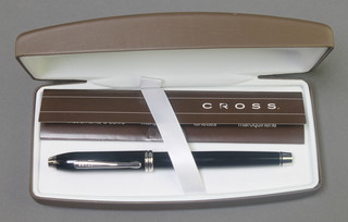 A cased cross black ballpoint pen