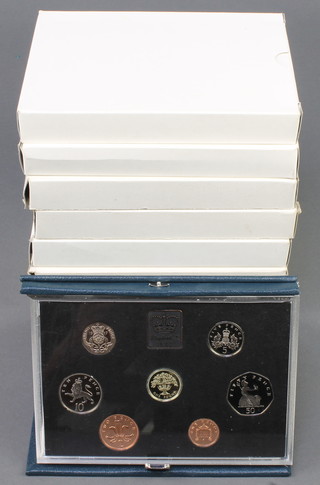 Eight United Kingdom proof coins sets 1983-1990, cased 