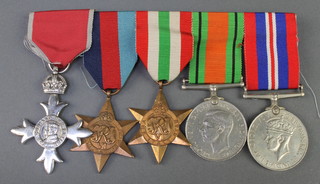 A World War II group MBE 1939-45 and Italy Star, Defence and British War medal 