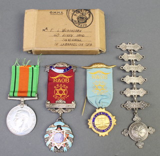 A Defence medal to F L Wetherby together with a silver St Johns Ambulance Association medallion with 6 bars, a Buffalo enamel medallion and 1 other 