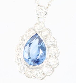 A white gold pear shaped sapphire and diamond pendant, the pear shaped sapphire approx. 1.8ct surrounded by brilliant cut diamonds approx. 0.80ct on an 18ct white gold chain