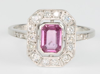 An 18ct white gold pink sapphire and diamond Edwardian style ring, the centre stone approx 1.0ct surrounded by brilliant cut diamonds approx. 0.85ct, size P