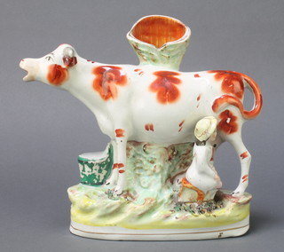 A Victorian Staffordshire spill vase with milkmaid and cow 9" 